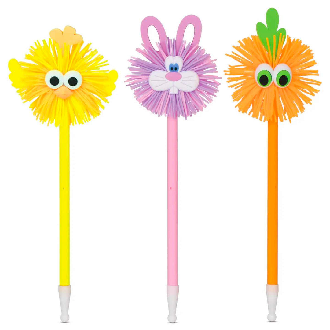 A set of three colorful pens, each with a cute face decoration on top. The animals appear to be a chick, rabbit, and a carrot.