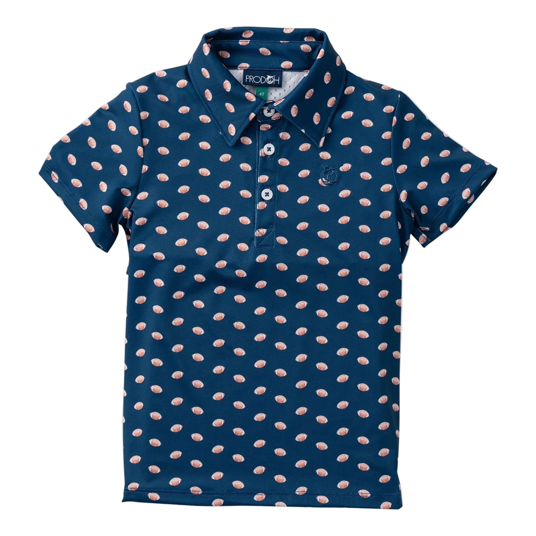 A short-sleeve polo shirt for kids in navy blue with a repeating pattern of small pink and white teardrop shapes, featuring a three-button placket and a small embroidered logo on the chest. prodoh