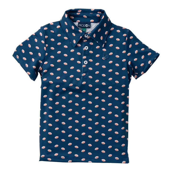 A short-sleeve polo shirt for kids in navy blue with a repeating pattern of small pink and white teardrop shapes, featuring a three-button placket and a small embroidered logo on the chest. prodoh